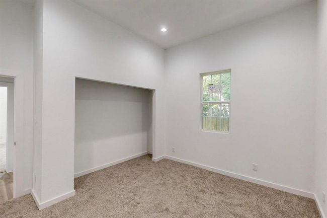 Unfurnished bedroom featuring carpet | Image 28