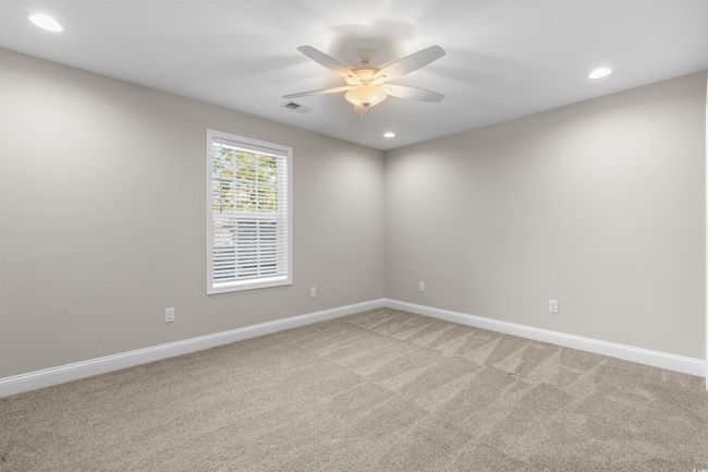 Spare room with a ceiling fan, light carpet, baseboards, and recessed lighting | Image 33