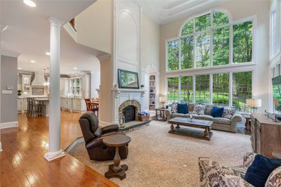 Grand two story Great Room over looking a professionally landscaped lot! Spectacular views all year long! | Image 3