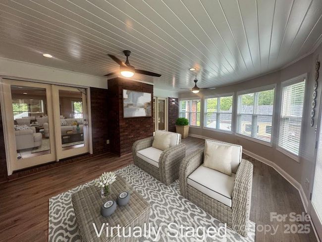 virtually staged sunroom view from garage entry | Image 29