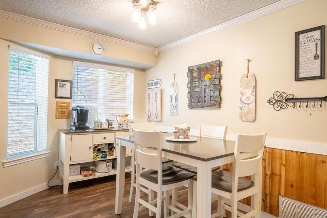 Adorable dining area with wall accents! | Image 13
