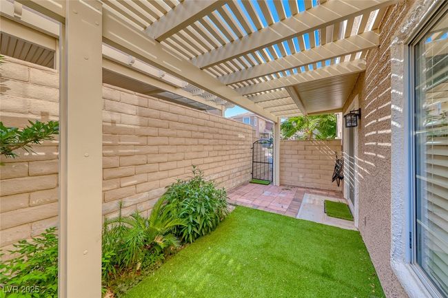 View of yard featuring a gate and a pergola | Image 32