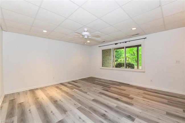 Updated flooring with Luxury vinyl throughout the apartment which is accessed from the main floor or daylight basement | Image 31