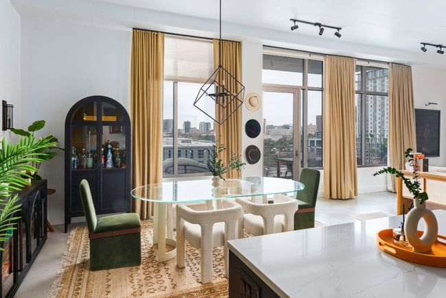Dining space featuring a city view | Image 12