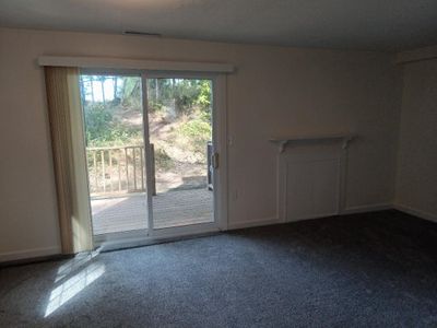 Living room leading to deck, all new flooring. | Image 2