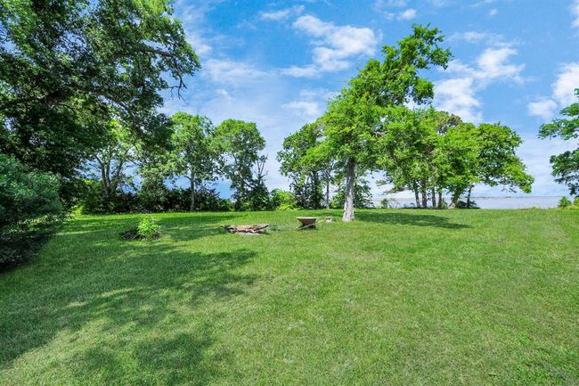 Tucked away in the corner near a pocket of trees might be a perfect spot for a picnic table! | Image 29