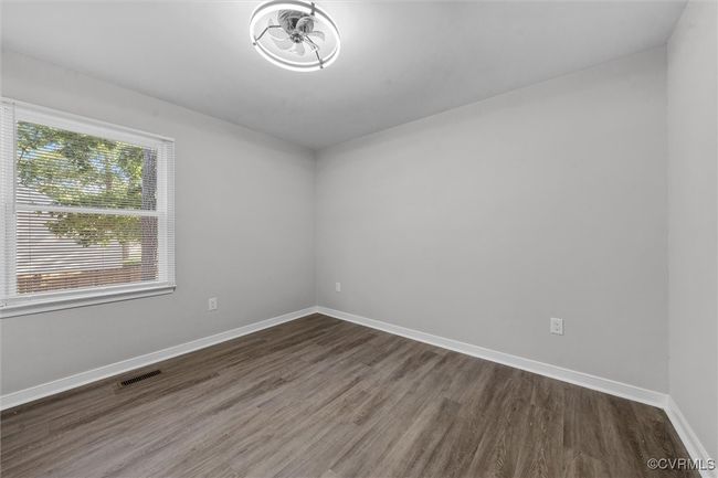 1st floor room with baseboards and wood finished floors | Image 35