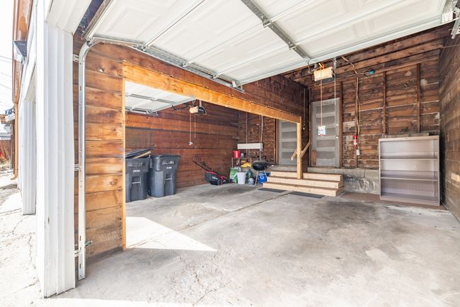 Garage with a garage door opener | Image 37