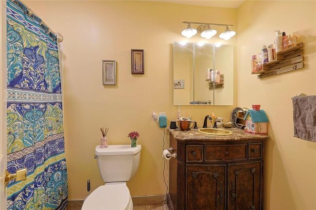 Full Bathroom featuring toilet and vanity | Image 14
