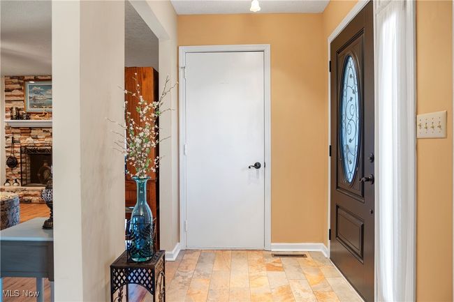 Foyer with baseboards and stone finish floor | Image 6