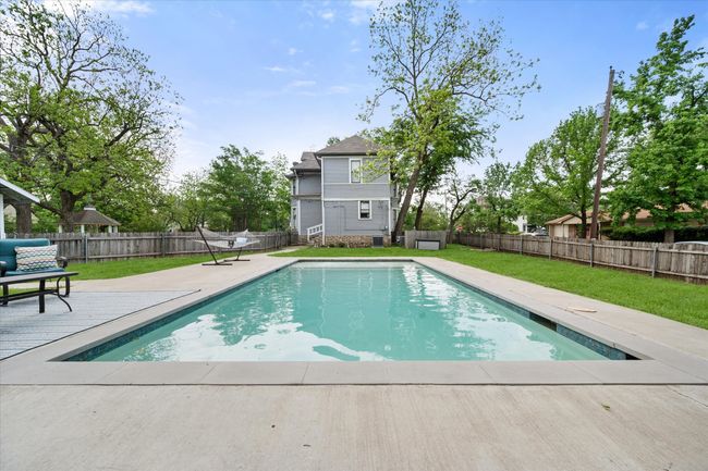 View of pool with a patio | Image 34