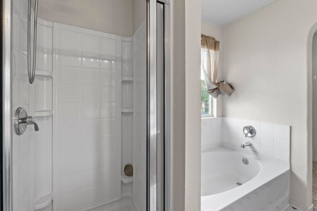 A look at the deep soaking tub and the walk-in shower. | Image 18
