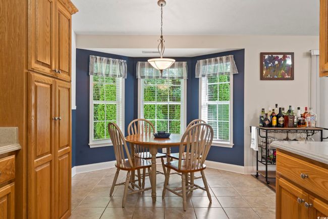 Dining area with baseboards and light tile patterned floors | Image 17