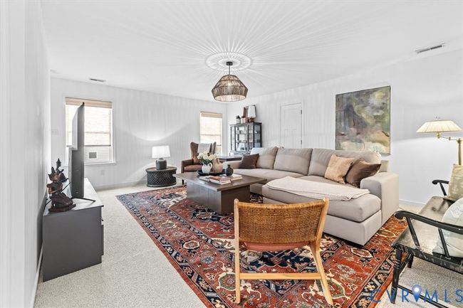 This space is currently being used as family room. Could also be an exercise room, play room, recreation room or so many other possibilities. | Image 26