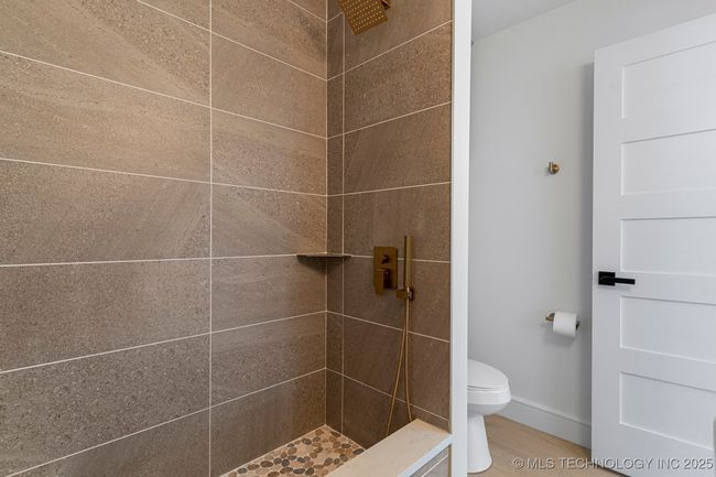 Sun room bathroom withy exterior access to pool and dog washing station | Image 69