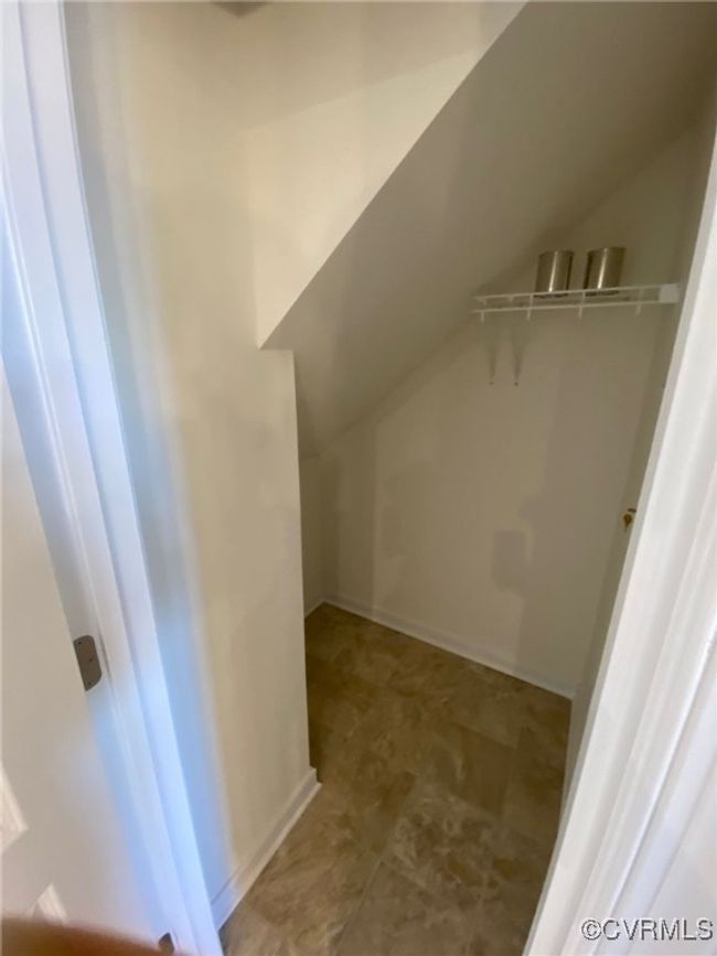 Spacious closet featuring lofted ceiling | Image 9