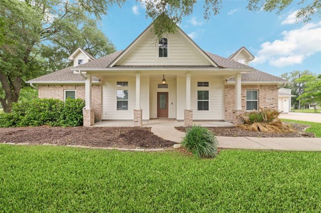 Tucked away on 1.5 serene acres in Manvel, this distinctive property is built for the way you want to live. The flexible floorpan allows between 4 to 6 bedrooms, 2.5 baths, a 2-car garage, in-ground pool, plus a 60'x30' insulated shop. | Image 7