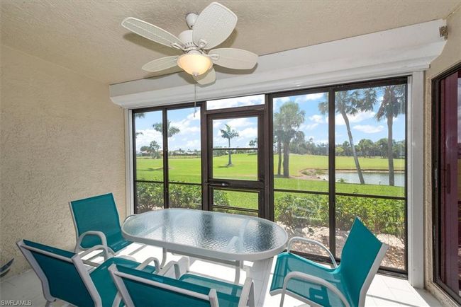 Sunroom featuring a water view and golf course view | Image 15
