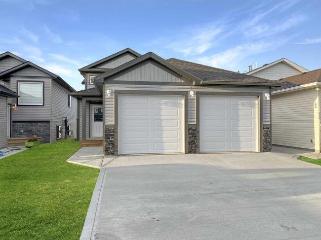 A - 9513 113 Avenue, Home with 3 bedrooms, 2 bathrooms and null parking in Clairmont AB | Image 1
