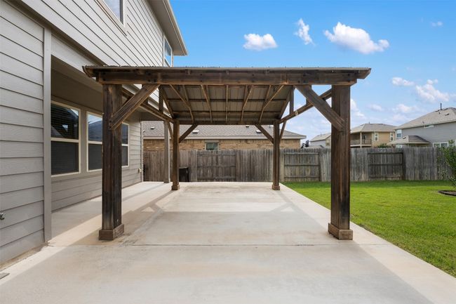 View of patio / terrace featuring a carport and a gazebo | Image 11