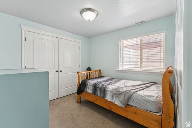 Carpeted bedroom featuring a closet | Image 28