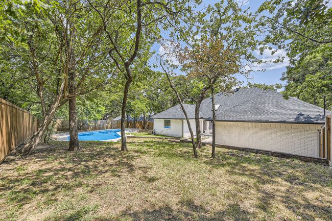 View of yard with a fenced backyard and a fenced in pool | Image 27