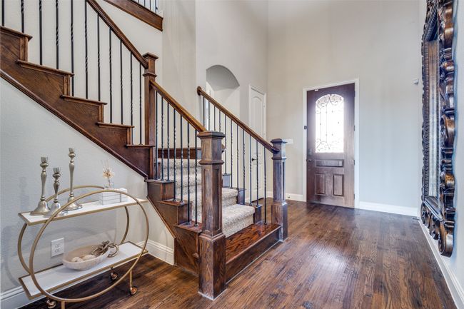 Entrance foyer featuring a high ceiling and dark hardwood / wood-style floors | Image 4