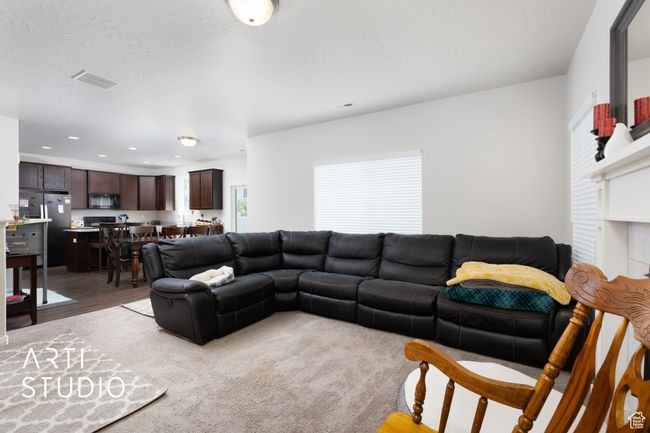 Living room featuring light wood-style floors and recessed lighting | Image 9