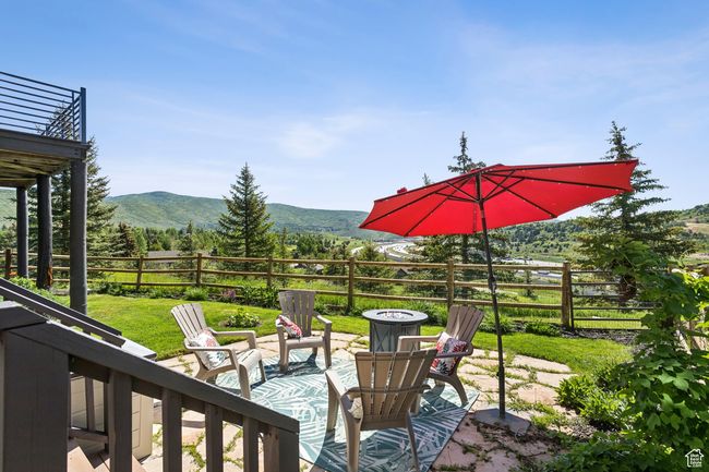 View of patio featuring an outdoor fire pit and a mountain view | Image 42
