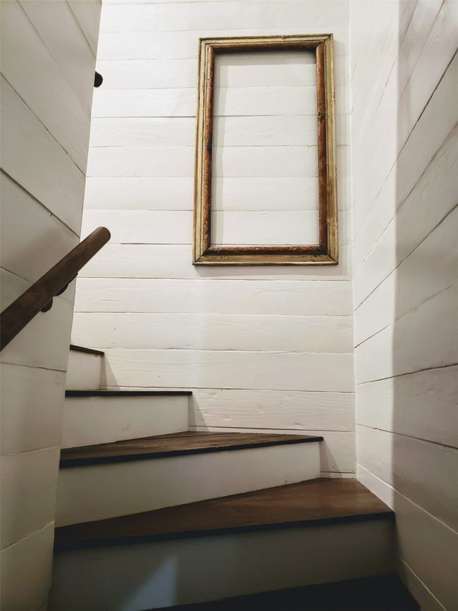 This stairway leads to the Attic suite. Nicely spaced steps that butterfly around with railing...access to room is at bottom of stairs with an 8 foot pine door with keypad entrance | Image 30