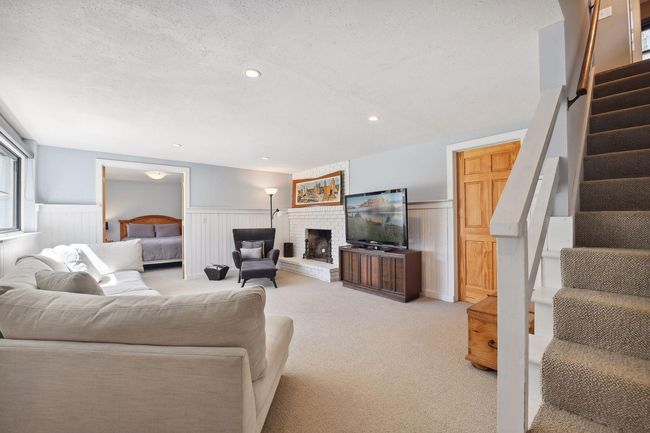 Additional gathering space is found on the lower level | Image 25