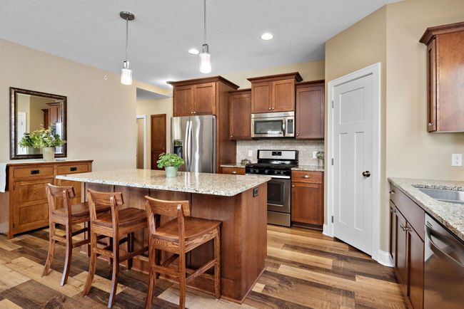 Gorgeous Custom Cherry Kitchen cabinets with granite countertops, large center island, breakfast bar, recessed and pendant lighting, walk-in pantry, tile backsplash, soft-close drawers & doors, gas range and stainless steel appliances - WOW! | Image 5