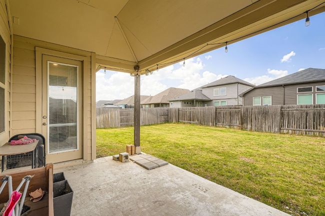 Fenced backyard featuring a patio and a residential view | Image 25