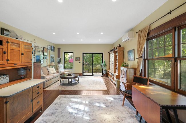 Flowing from kitchen, main floor family room. | Image 14
