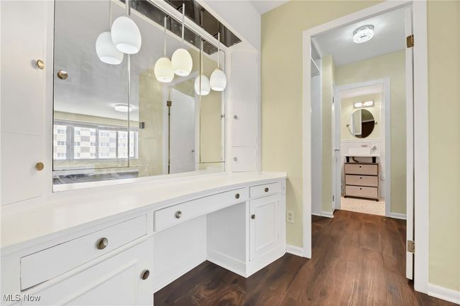 Bathroom with baseboards, wood finished floors, and vanity | Image 25