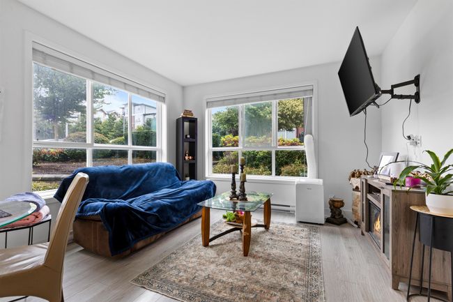 Living area featuring light wood finished floors | Image 32