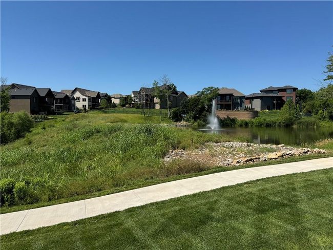 View of green lawn with a residential view and a water view | Image 71