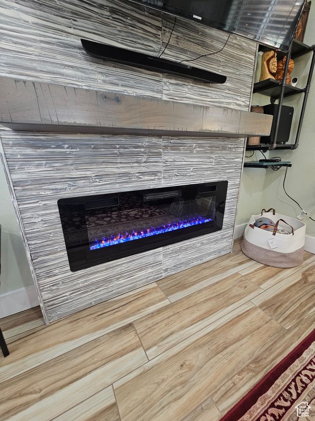 Glass covered fireplace with stone surround | Image 27