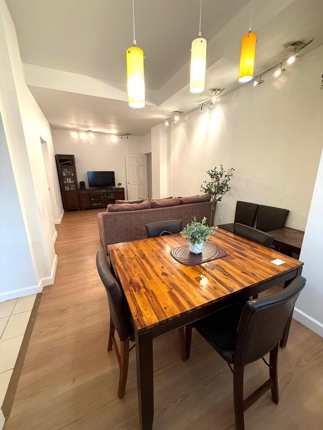 Dining space featuring track lighting, light wood-style floors, and baseboards | Image 6