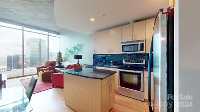 Kitchen with Fantastic Storage and Even Better Views of Uptown | Image 3