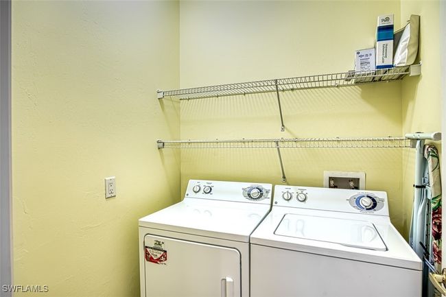 Clothes washing area with washer and dryer | Image 42