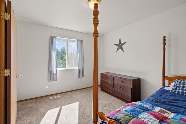 Bedroom with carpet and baseboards | Image 21