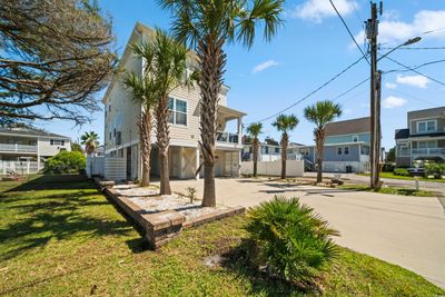 Exterior space featuring a front lawn and a carport | Image 2