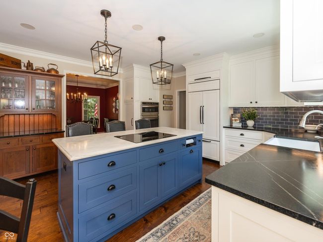 Beautiful Renovated Kitchen with Quartzite Counter on the Island and Soapstone Counters | Image 12