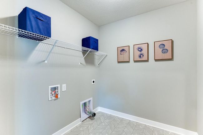 Life's simple pleasures - this one in the form of upper level laundry, just steps from each of the home's upper level bedroom!! Photo of model home, color and options will vary. | Image 30