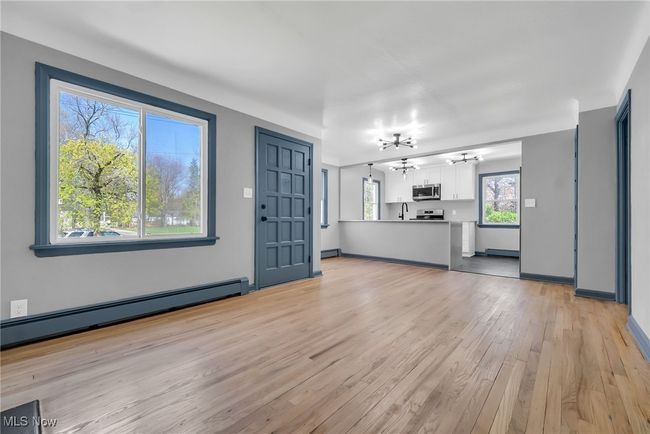 hardwood floors and open floor plan | Image 7