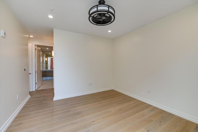 Empty room featuring recessed lighting, light wood finished floors, and baseboards | Image 8