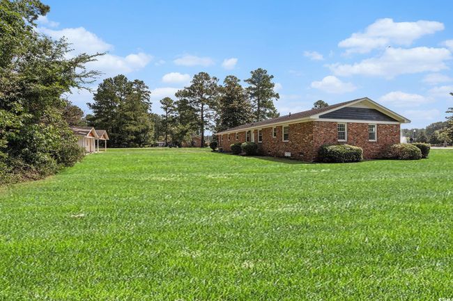 This large estate size lot offers you the privacy of country living, ample room for gardening and other outdoor activities, and room to expand your home if you desire. | Image 7