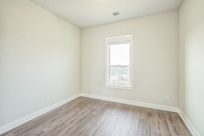 Unfurnished room featuring light wood-style floors and baseboards | Image 9