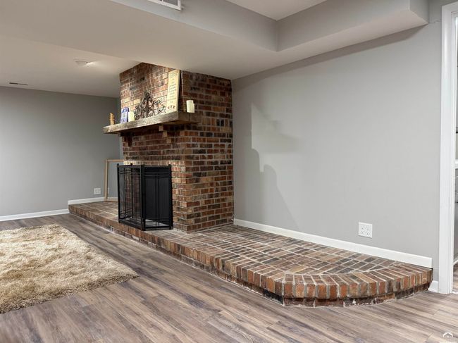 Solid masonry is handsome, but needs an electric insert or media app. Great rec room space. | Image 46
